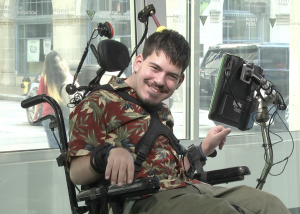 Mark Steidl in his favorite tropicale shirt, in wheelchair