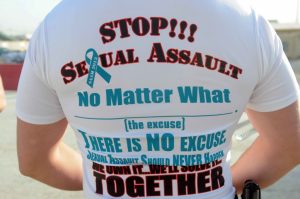 Back of person with T-shirt with anti-assault logos