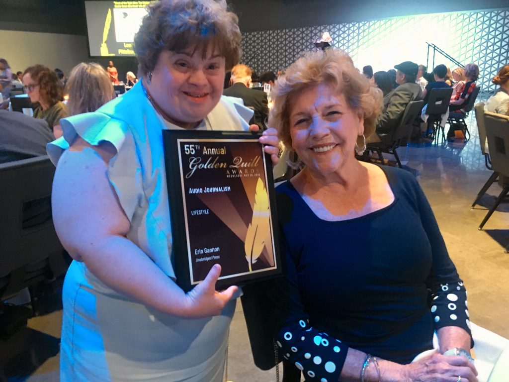 Daughter holding award and Mother at right.