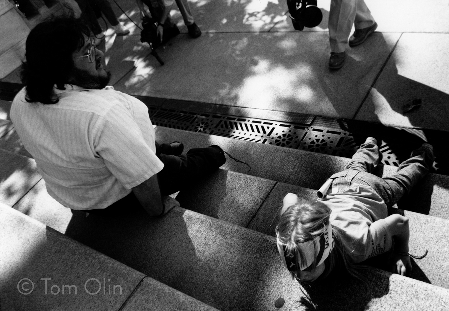 Eight year old girl pulls herself up steps of U.S. Capitol to protest discrimination against people with disabilities.