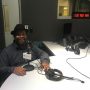 The main photo features David Hale, a black man wearing a fedora and a dark button down shirt. in front of a microphone in a podcast studio.